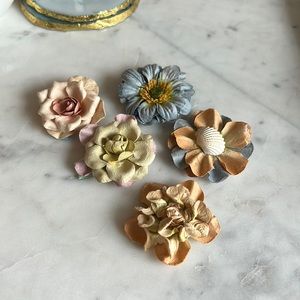 Handmade paper flower barrettes.